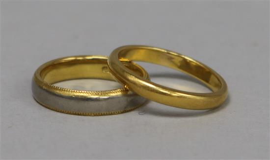 A 22ct gold wedding band and a two colour 18ct gold band.